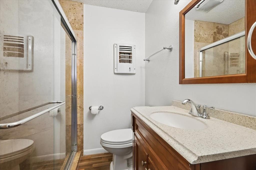 2508 West Rochelle Road Irving, TX 75062 - Photo 14 of 19 a bathroom with a sink toilet and a mirror