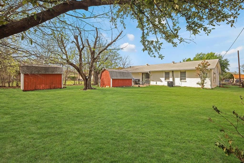 2508 West Rochelle Road Irving, TX 75062 - Photo 16 of 19 a view of house with backyard