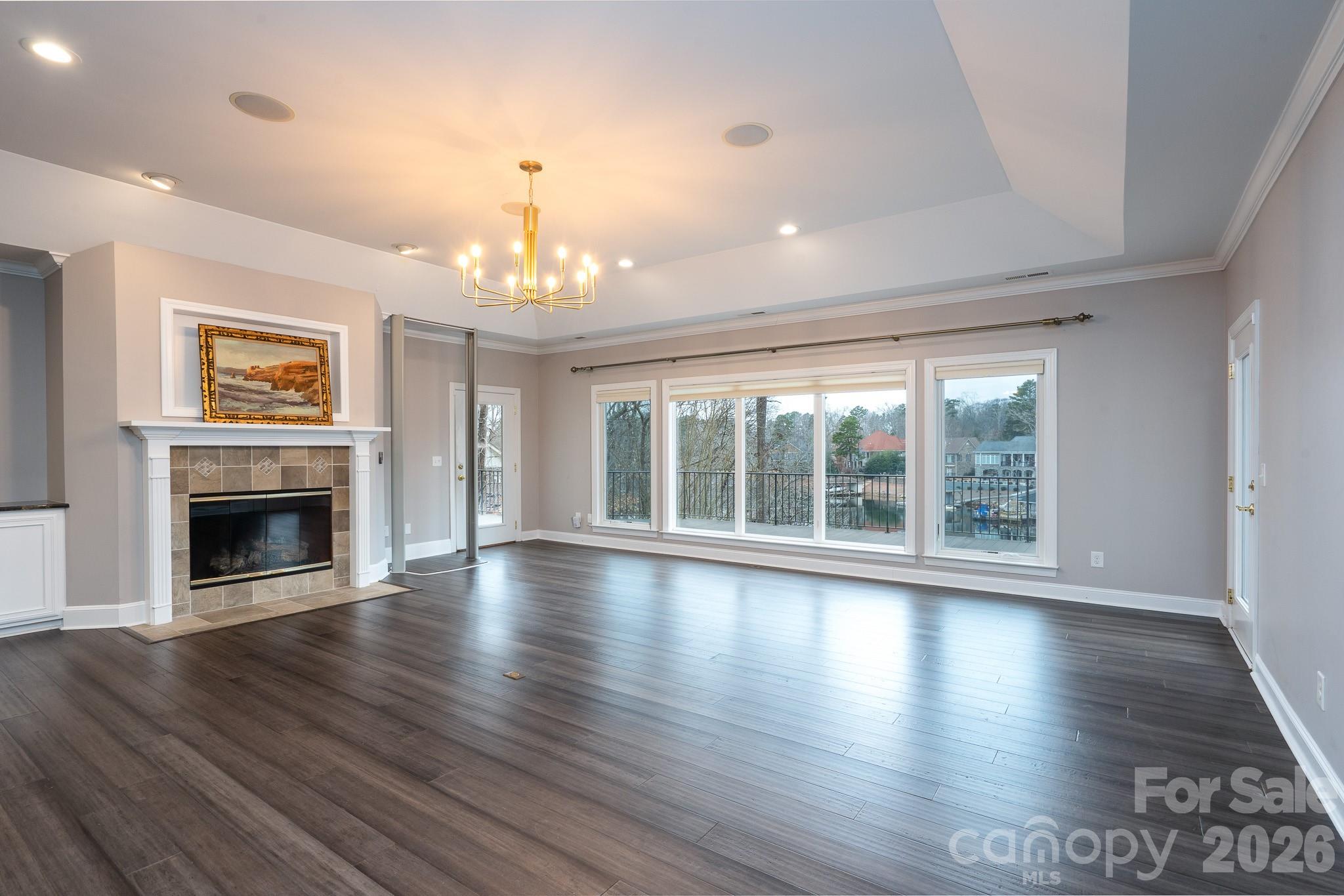 338 PLANTATION Way Mount Gilead, NC 27306 - Photo 13 of 48 a view of an empty room with wooden floor and a window