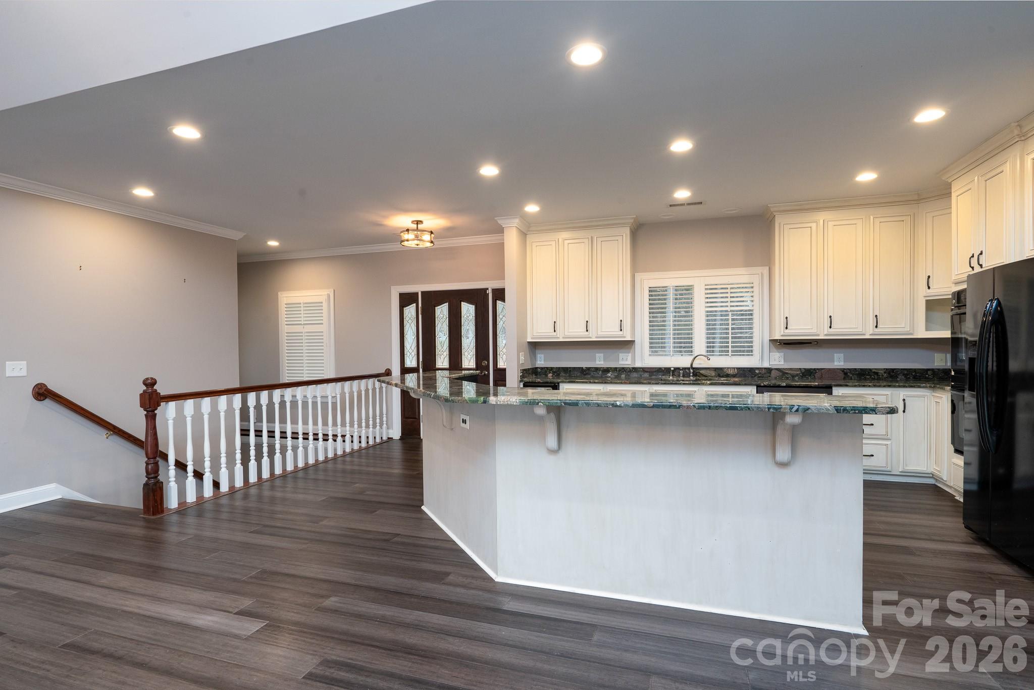 338 PLANTATION Way Mount Gilead, NC 27306 - Photo 15 of 48 a kitchen with stainless steel appliances granite countertop a sink a stove a refrigerator and cabinets