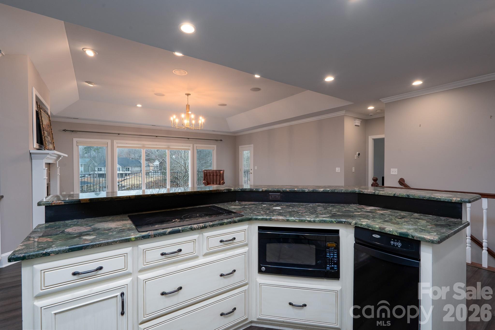 338 PLANTATION Way Mount Gilead, NC 27306 - Photo 16 of 48 a kitchen with granite countertop a stove and a sink