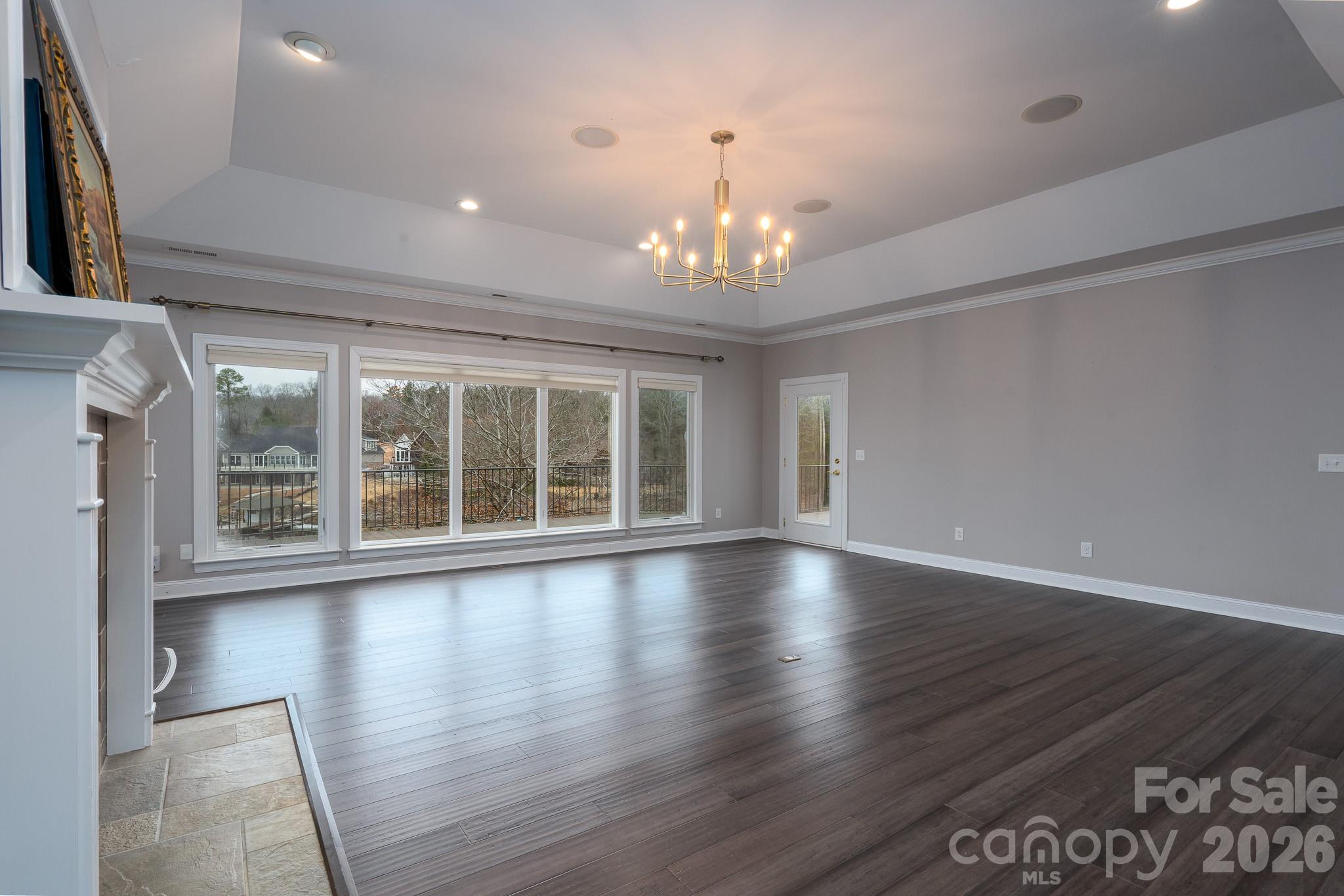 338 PLANTATION Way Mount Gilead, NC 27306 - Photo 18 of 48 a view of an empty room with wooden floor and a window