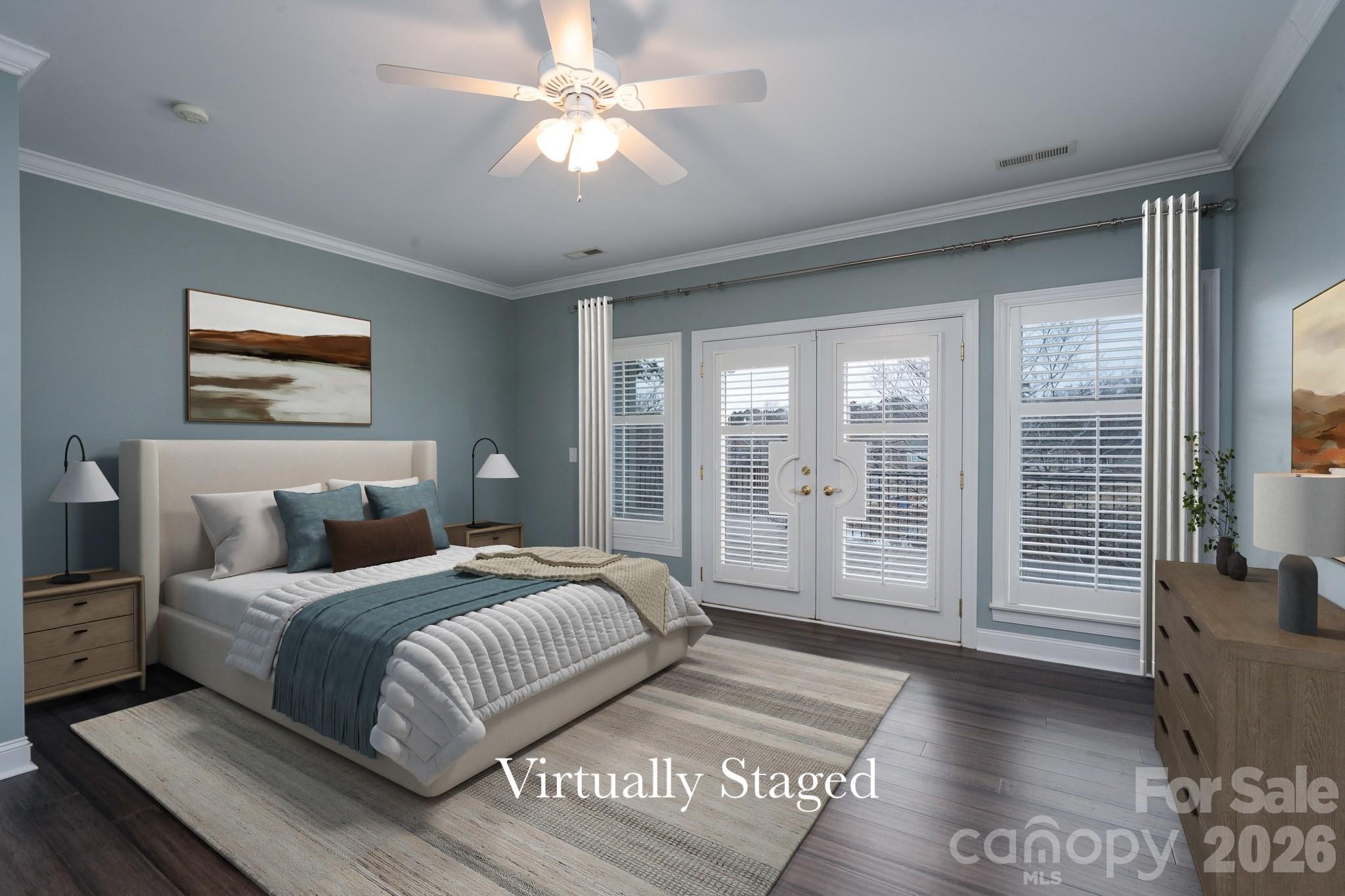 338 PLANTATION Way Mount Gilead, NC 27306 - Photo 21 of 48 a spacious bedroom with a large bed and a chandelier