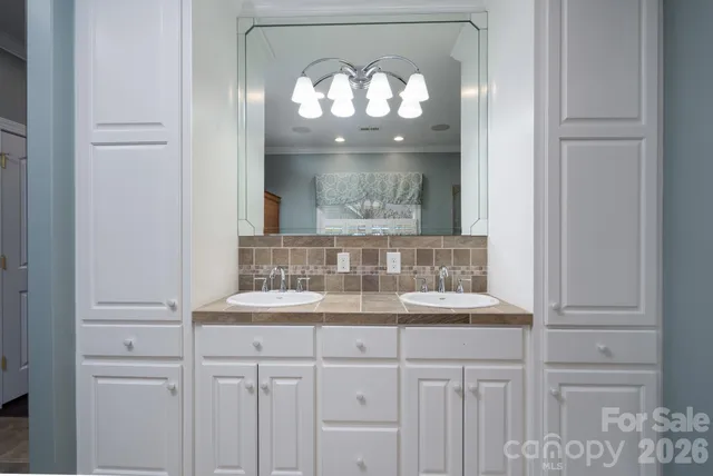 a view of empty room with wooden floor and a fireplace