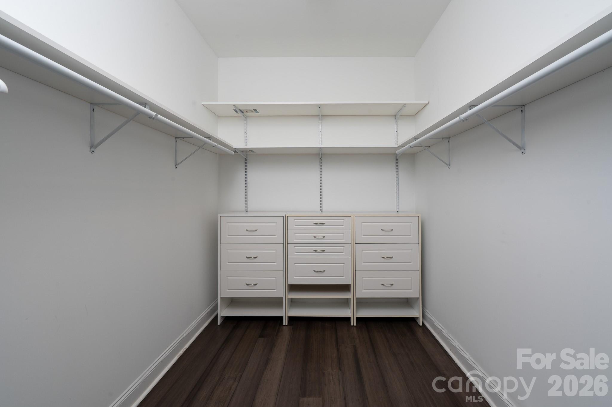 338 PLANTATION Way Mount Gilead, NC 27306 - Photo 23 of 48 a view of walk in closet with empty racks