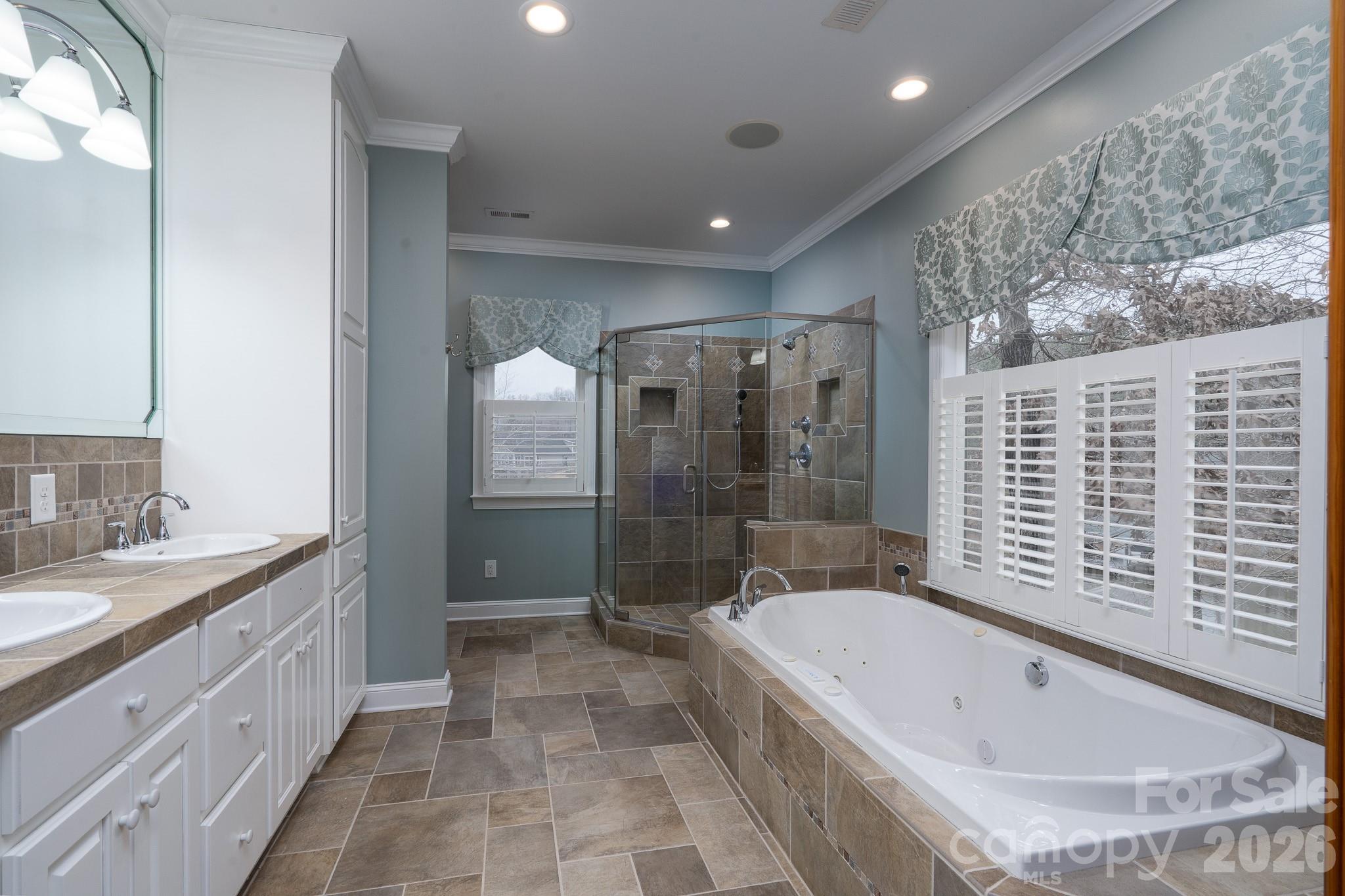 338 PLANTATION Way Mount Gilead, NC 27306 - Photo 24 of 48 a bathroom with a bathtub and a sink