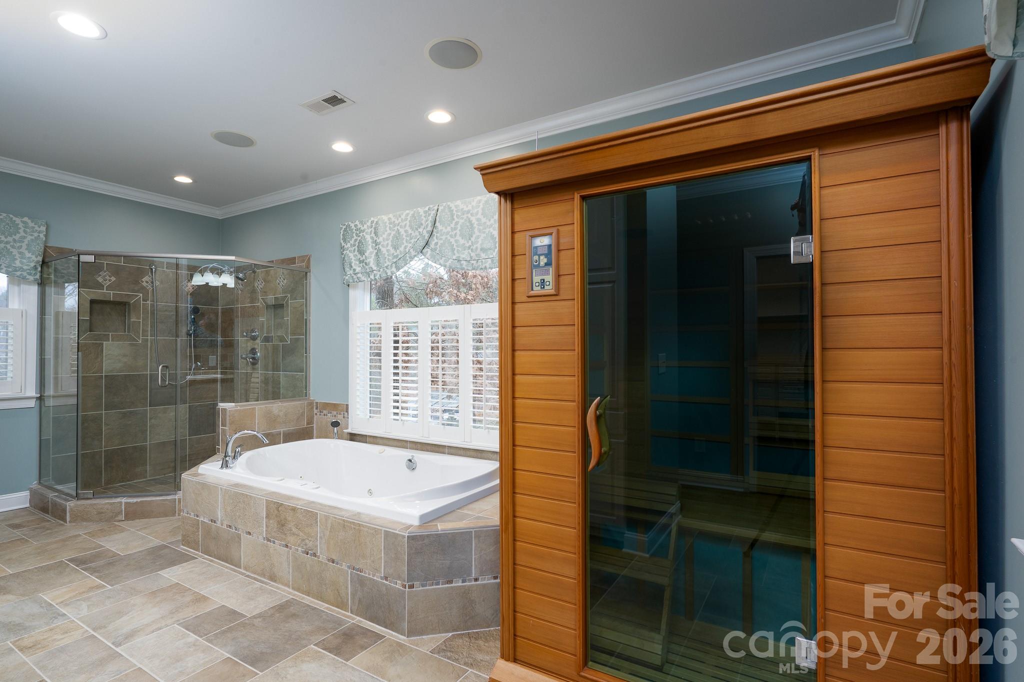 338 PLANTATION Way Mount Gilead, NC 27306 - Photo 26 of 48 a bathroom with a tub and shower