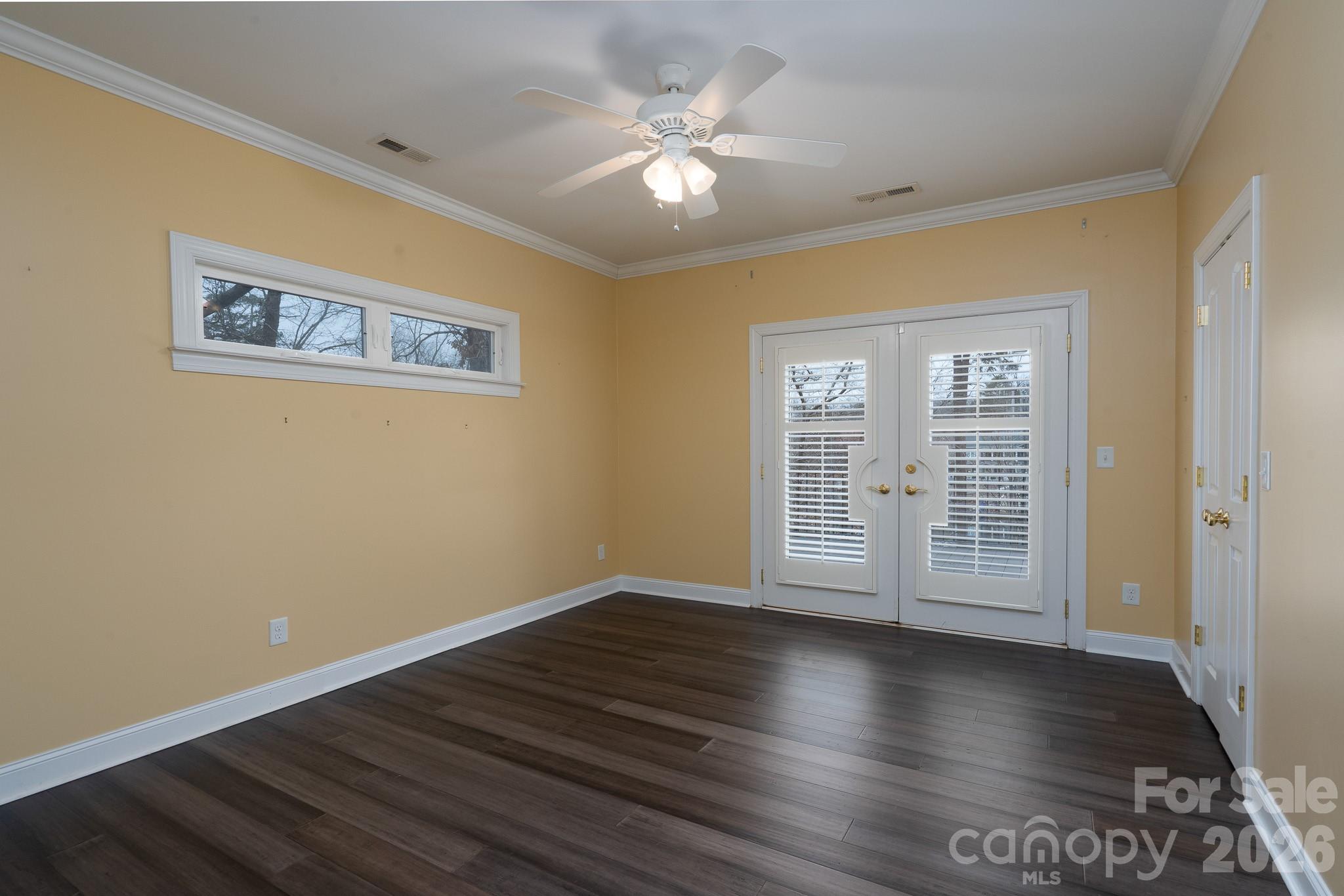 338 PLANTATION Way Mount Gilead, NC 27306 - Photo 29 of 48 a view of an empty room with wooden floor and a window
