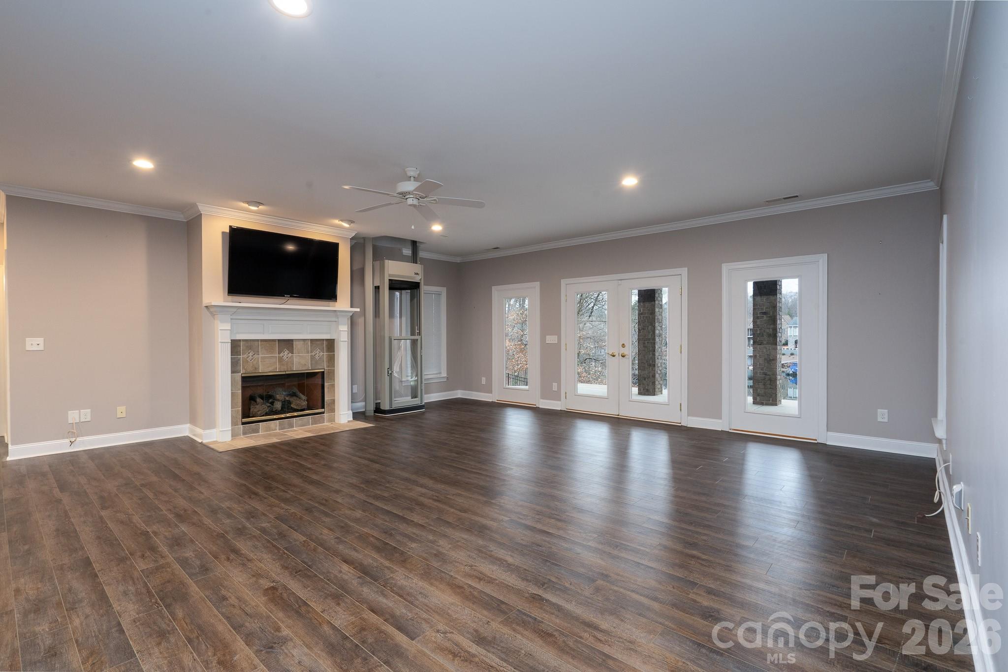 338 PLANTATION Way Mount Gilead, NC 27306 - Photo 34 of 48 a view of an empty room with wooden floor and a fireplace