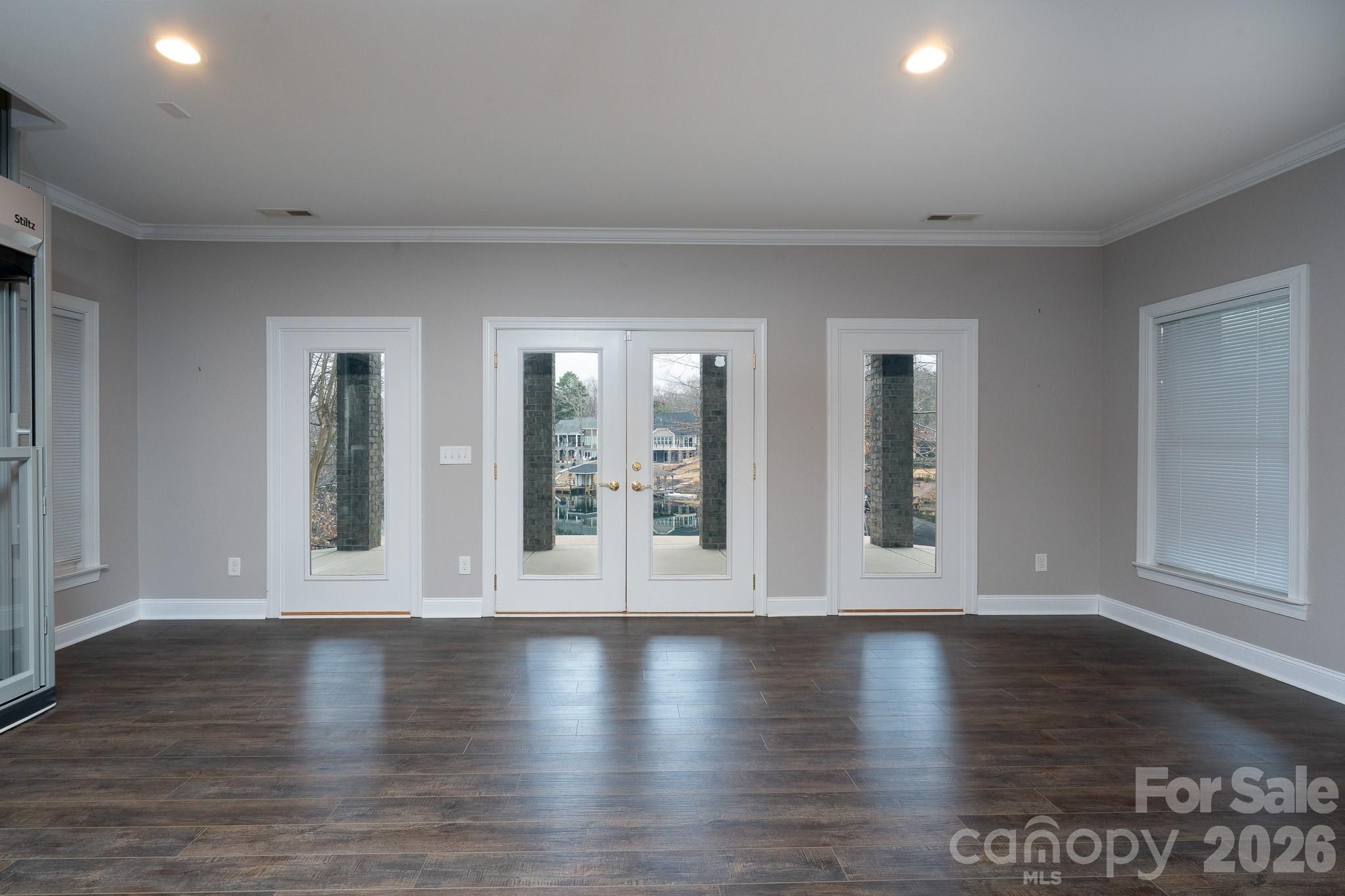 338 PLANTATION Way Mount Gilead, NC 27306 - Photo 36 of 48 a view of an empty room with wooden floor and a window