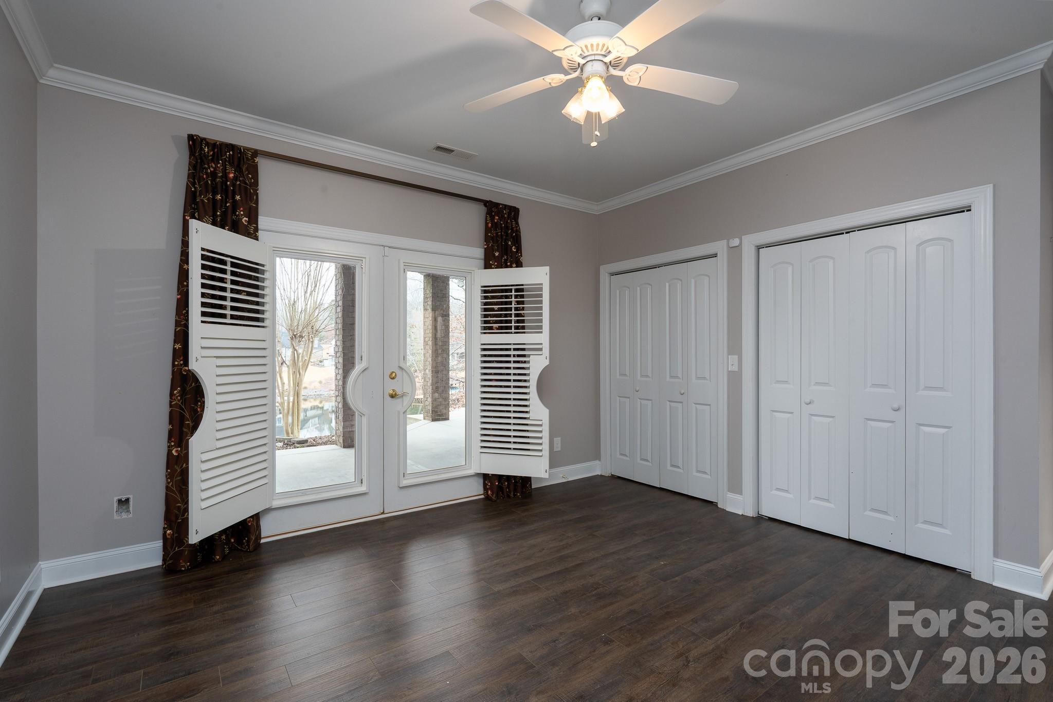 338 PLANTATION Way Mount Gilead, NC 27306 - Photo 42 of 48 an empty room with wooden floor and windows