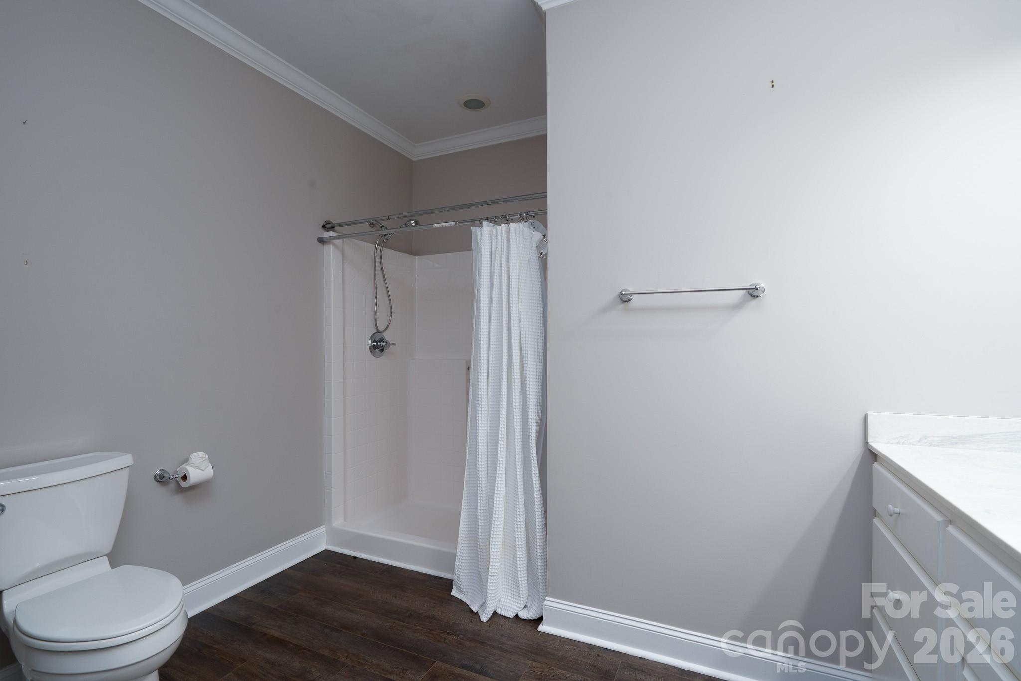 338 PLANTATION Way Mount Gilead, NC 27306 - Photo 43 of 48 a bathroom with a toilet and a shower