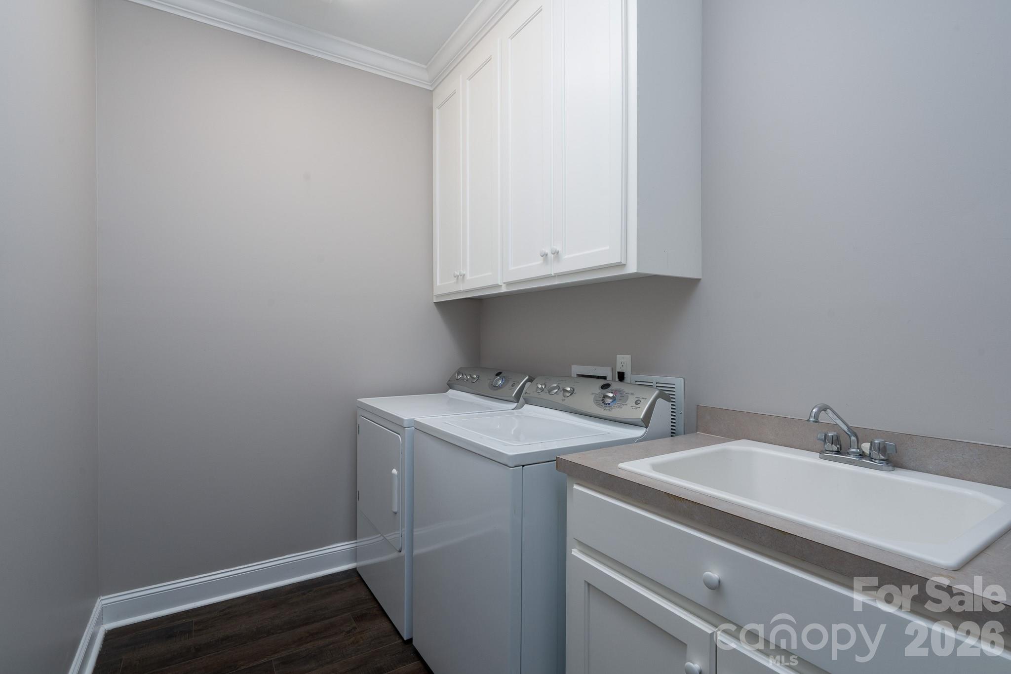 338 PLANTATION Way Mount Gilead, NC 27306 - Photo 45 of 48 a bathroom with a sink and cabinets