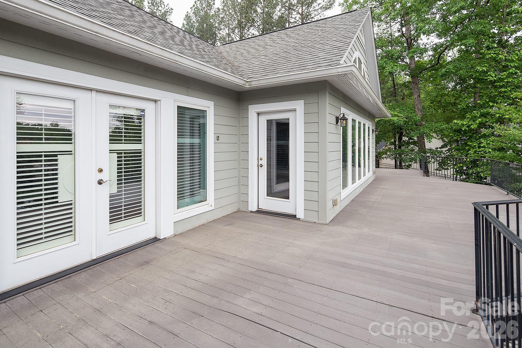 338 PLANTATION Way Mount Gilead, NC 27306 - Photo 47 of 48 a view of a house with a wooden deck and backyard