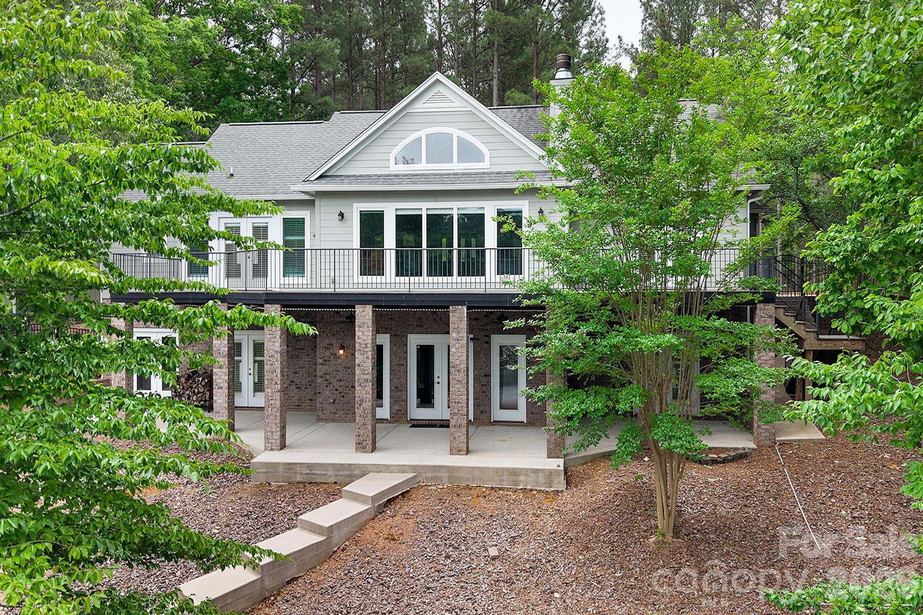 338 PLANTATION Way Mount Gilead, NC 27306 - Photo 6 of 48 a front view of a house with garden