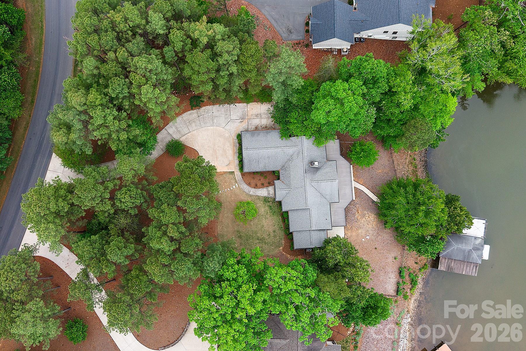 338 PLANTATION Way Mount Gilead, NC 27306 - Photo 7 of 48 an aerial view of a house with a yard and garden