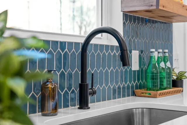 a kitchen with a sink and a window