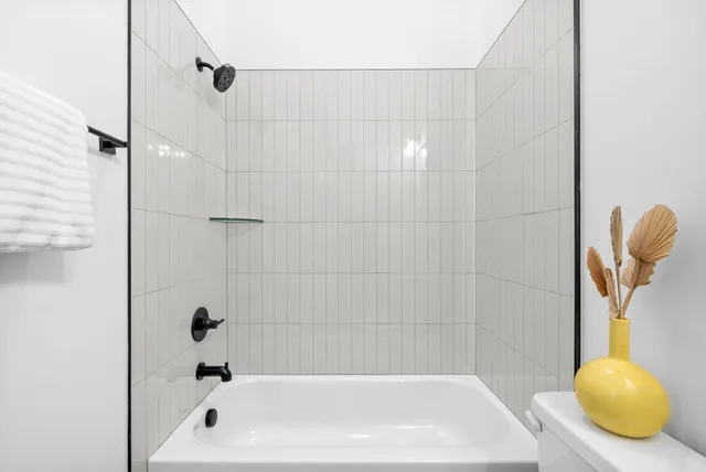 a bedroom with a bed and a chair