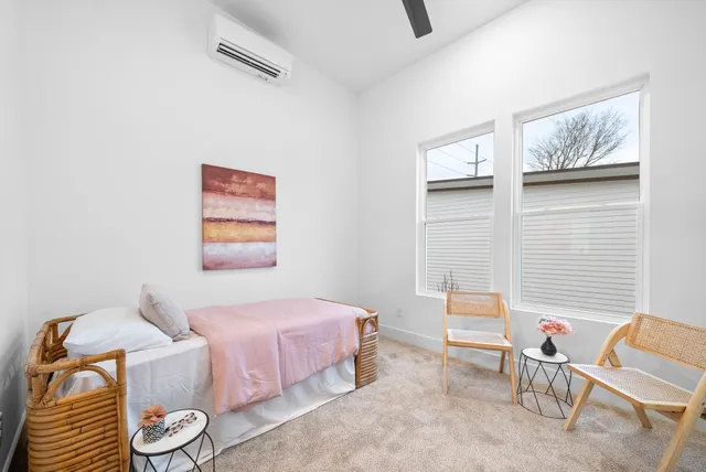 a bedroom with a bed and furniture