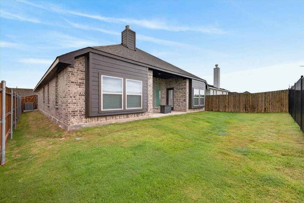 653 Godley Ranch Godley, TX 76044 - Photo 30 of 35 a view of a house with a backyard