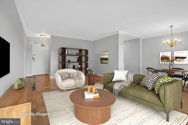a living room with furniture and a chandelier