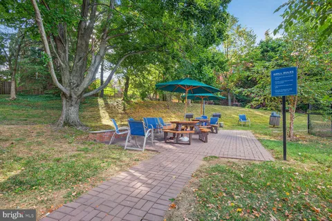 a view of swimming pool with outdoor seating