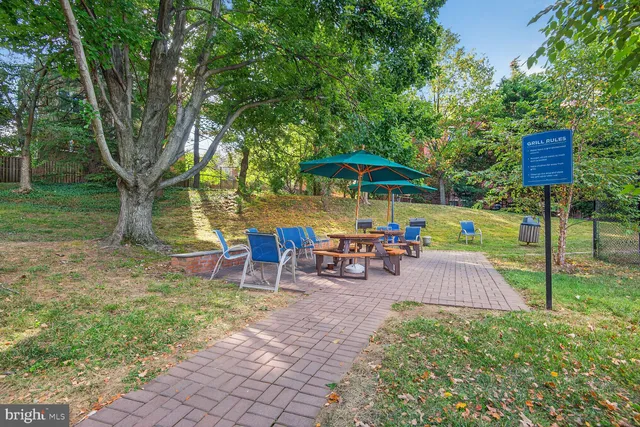 a view of swimming pool with outdoor seating