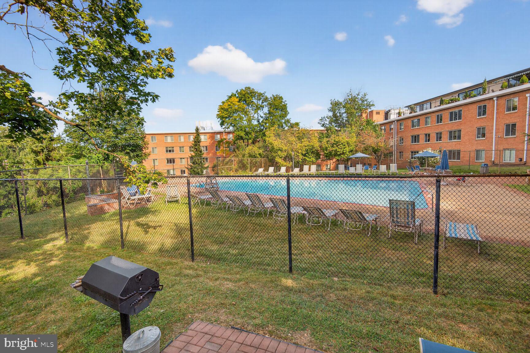 3000 Spout Run Parkway, Unit A306 Arlington, VA 22201 - Photo 20 of 26 a view of swimming pool with outdoor seating