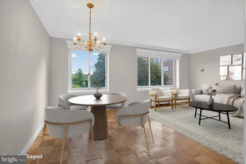 a view of a dining room with furniture window and outside view