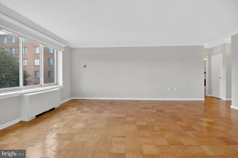 a view of an empty room with a window