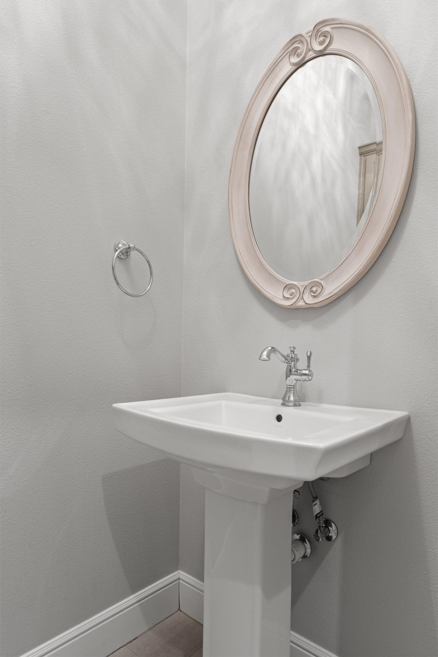 136 Fawn Hollow Elgin, TX 78621 - Photo 30 of 40 Half bath with pedestal sink with chrome faucet and hardware