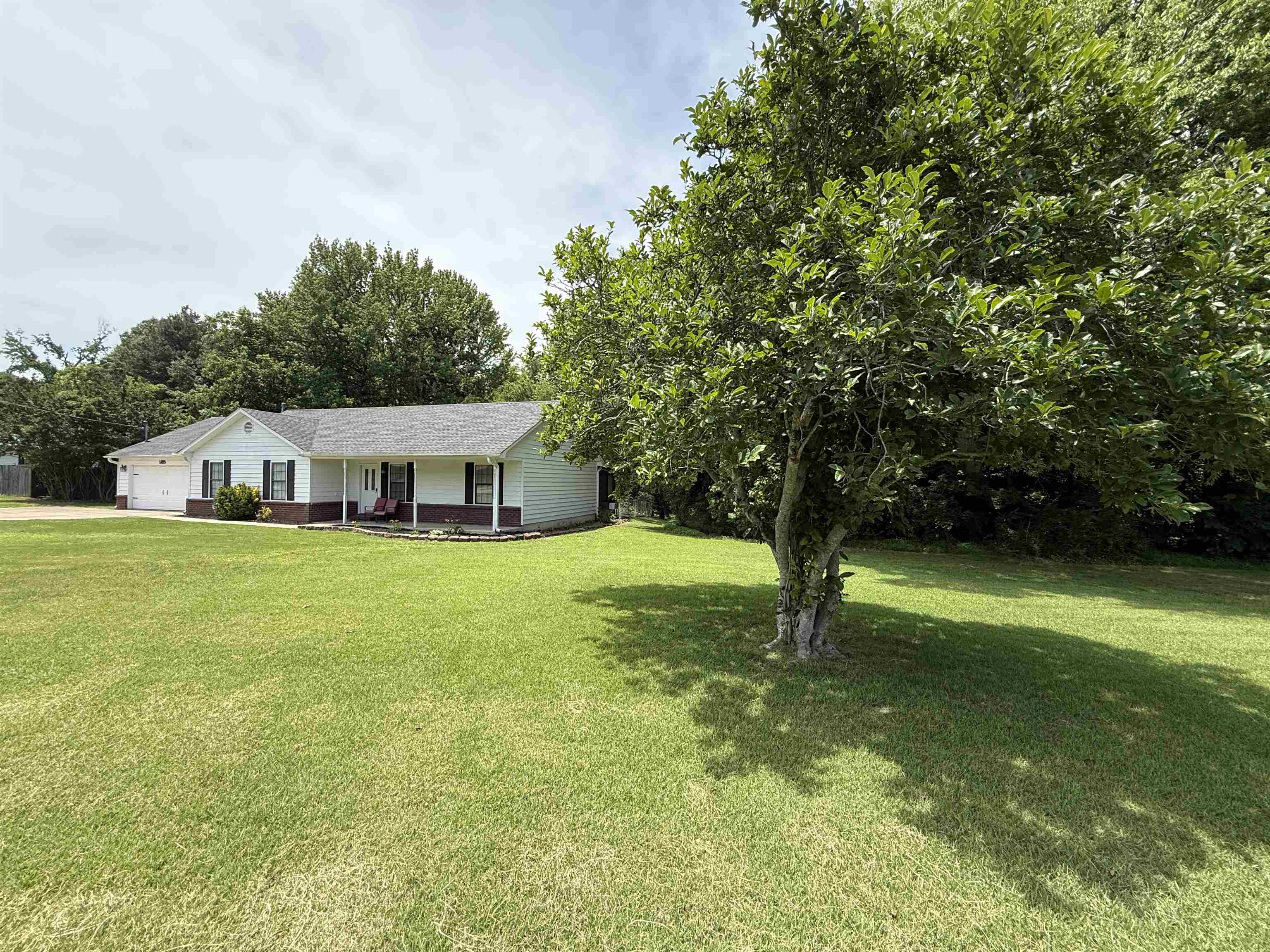 185 Mignon Road Atoka, TN 38004 - Photo 3 of 34 White siding residence featuring a covered front porch with dark pillars