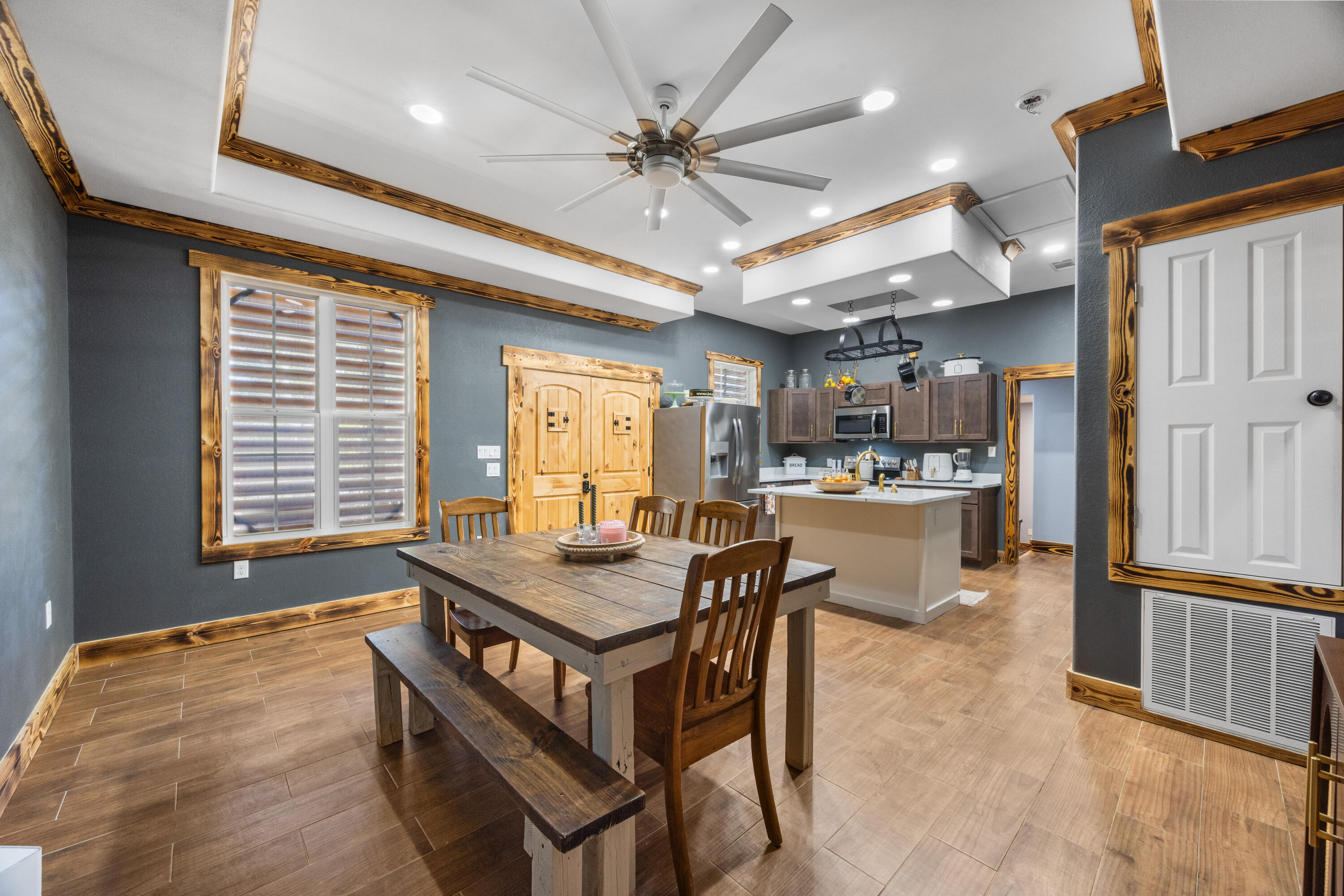 981 East Chestnut Avenue Crestview, FL 32539 - Photo 19 of 80 a dining hall with stainless steel appliances kitchen island granite countertop furniture and a large window
