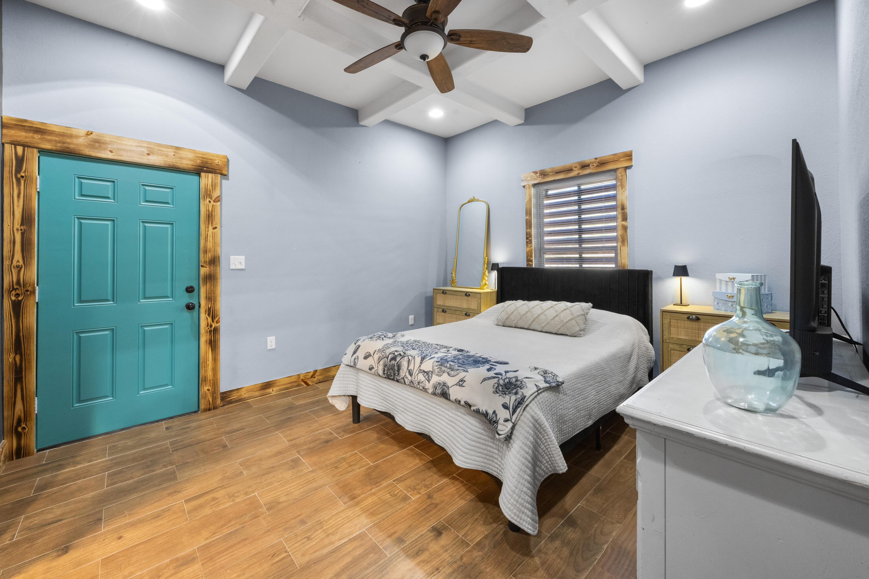 981 East Chestnut Avenue Crestview, FL 32539 - Photo 25 of 80 a bedroom with a bed and a flat screen tv