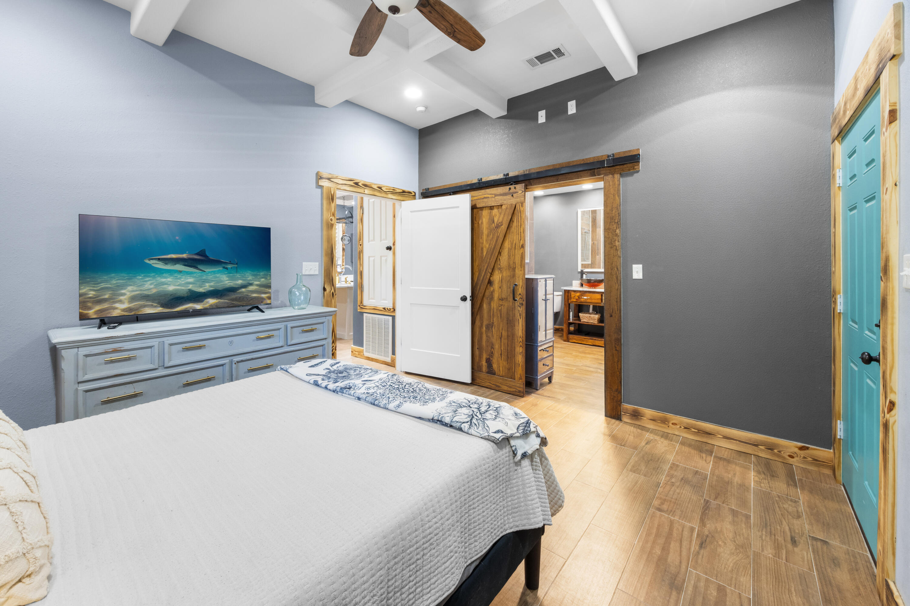 981 East Chestnut Avenue Crestview, FL 32539 - Photo 26 of 80 a bedroom with a bed and a flat screen tv