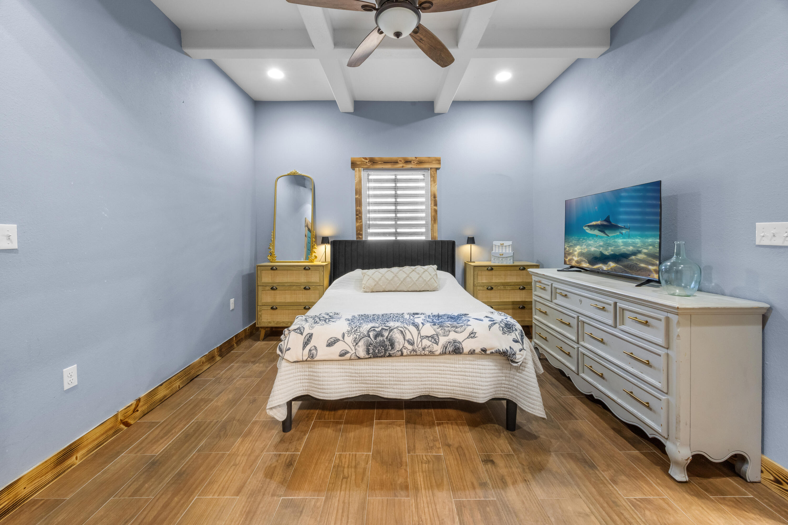 981 East Chestnut Avenue Crestview, FL 32539 - Photo 27 of 80 a spacious bedroom with a bed and a flat screen tv