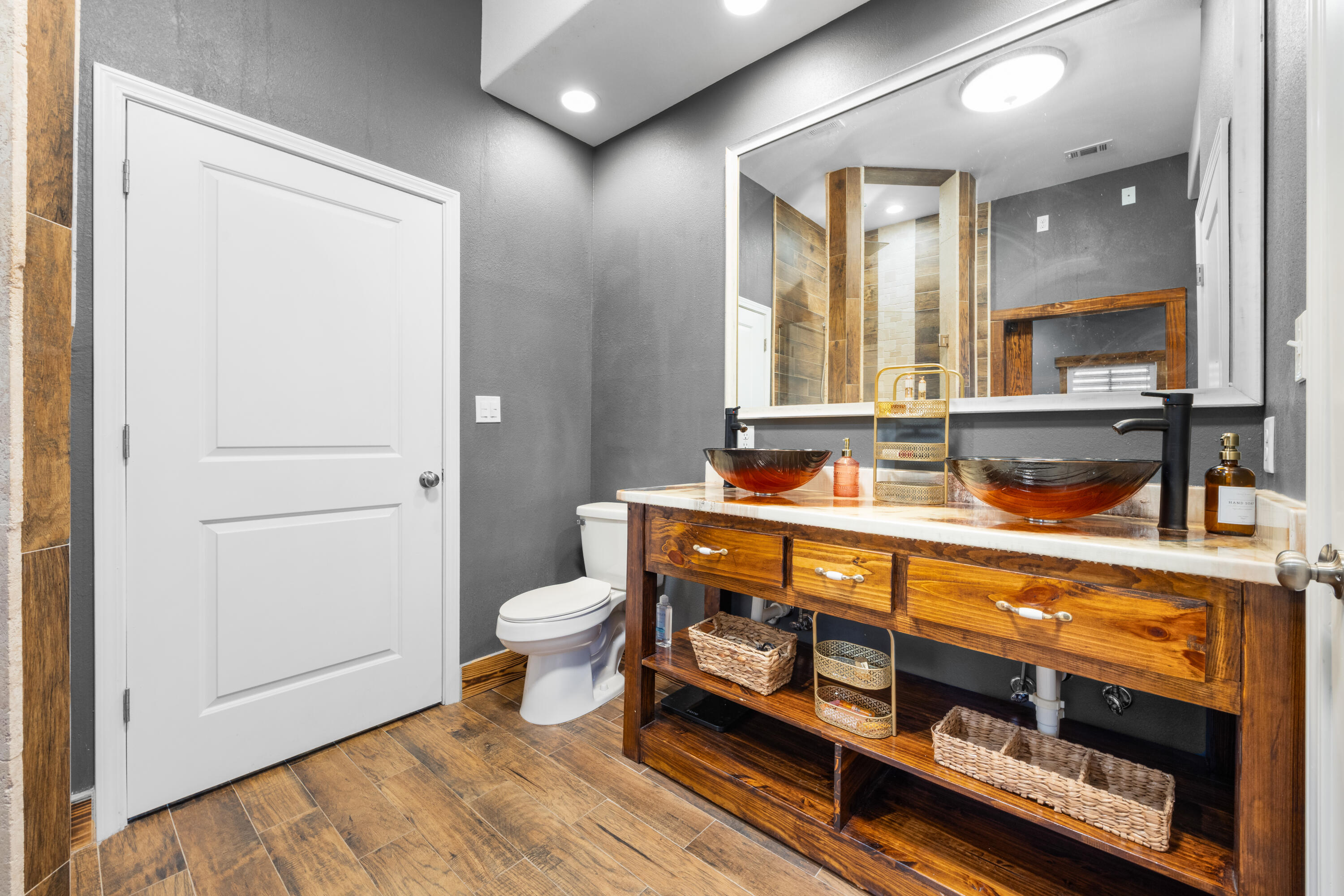 981 East Chestnut Avenue Crestview, FL 32539 - Photo 30 of 80 a bathroom with a sink mirror and a toilet