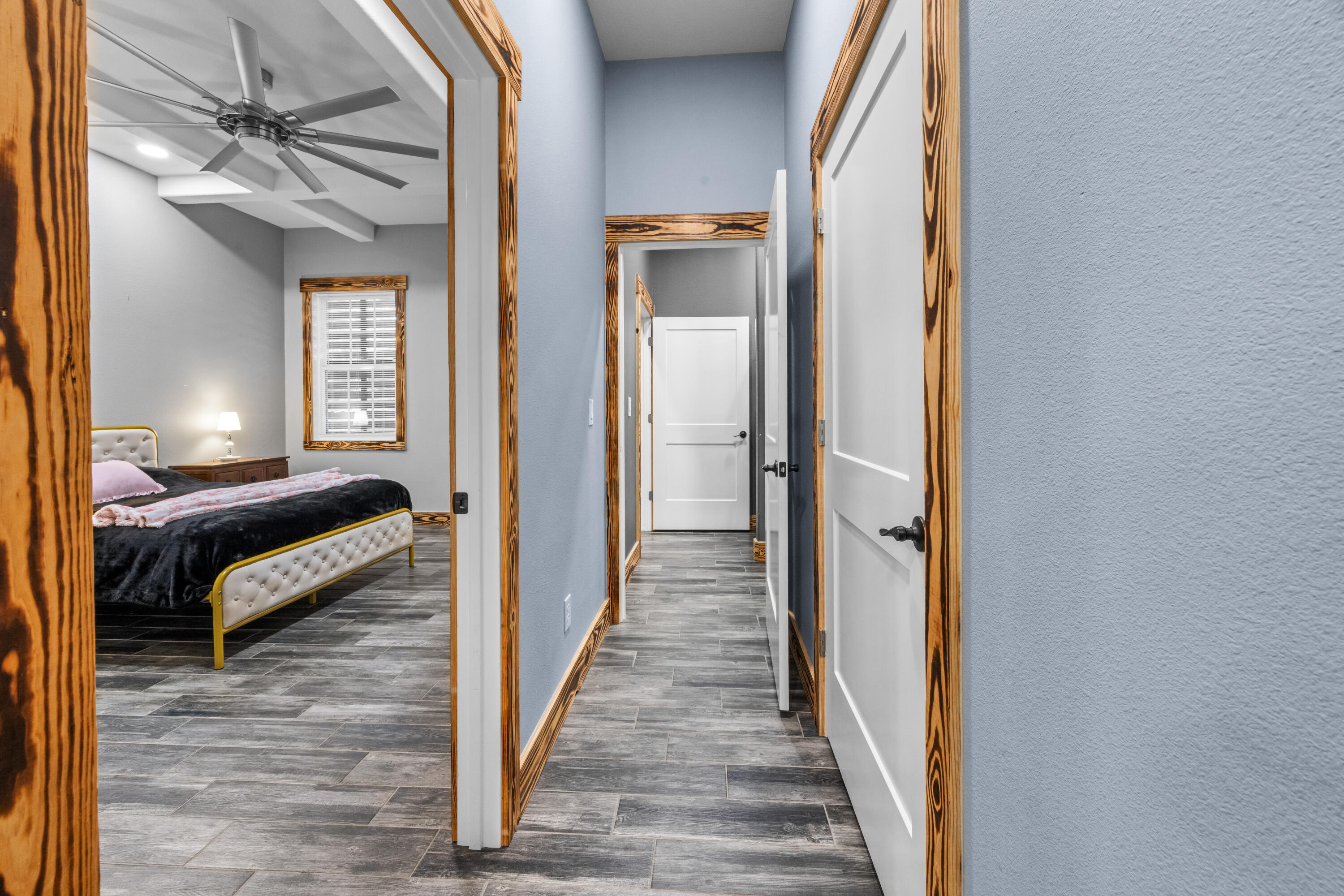 981 East Chestnut Avenue Crestview, FL 32539 - Photo 37 of 80 a view of a hallway with a bedroom and wooden floor
