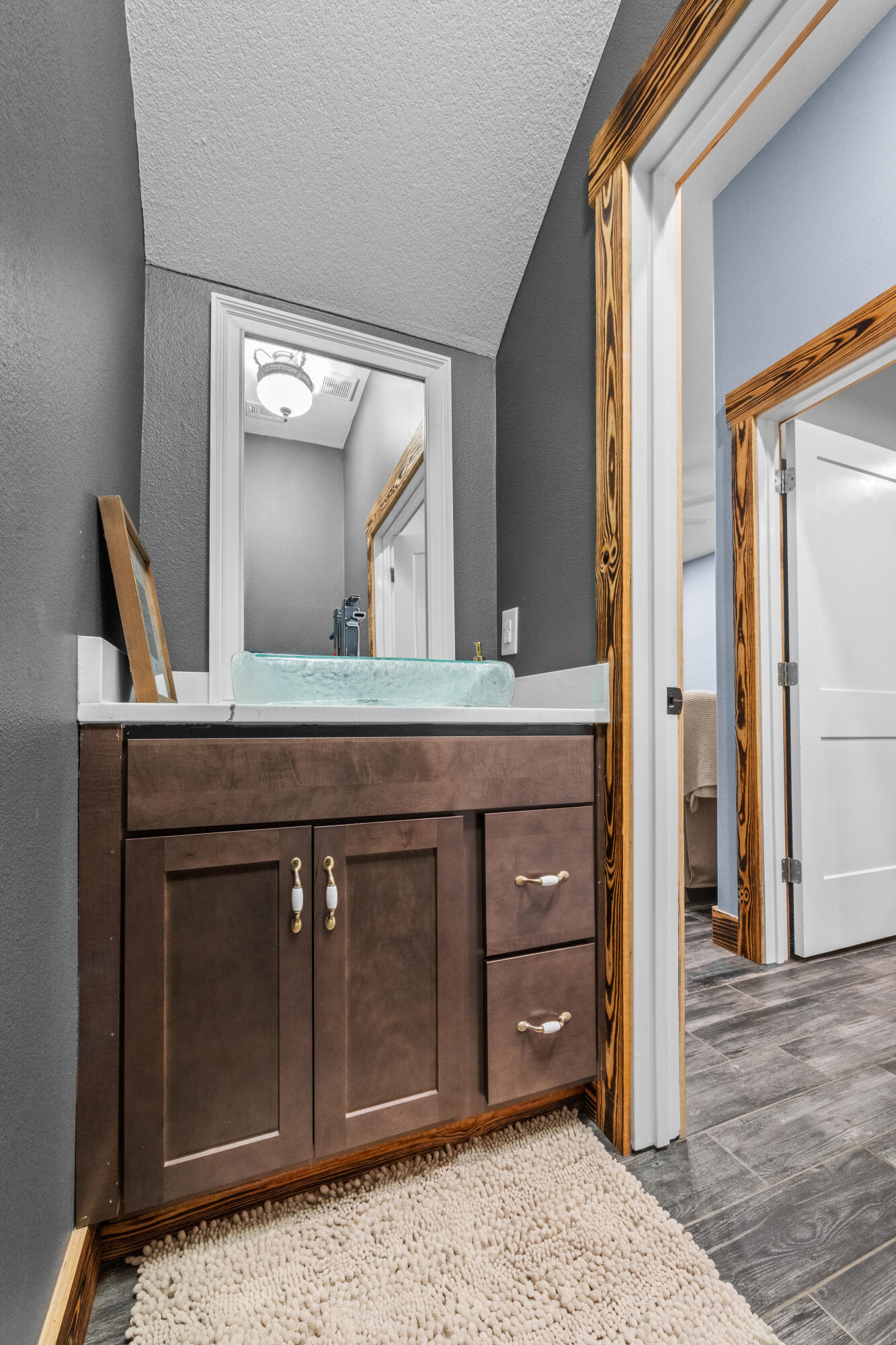 981 East Chestnut Avenue Crestview, FL 32539 - Photo 39 of 80 a bathroom with a sink a vanity and a mirror