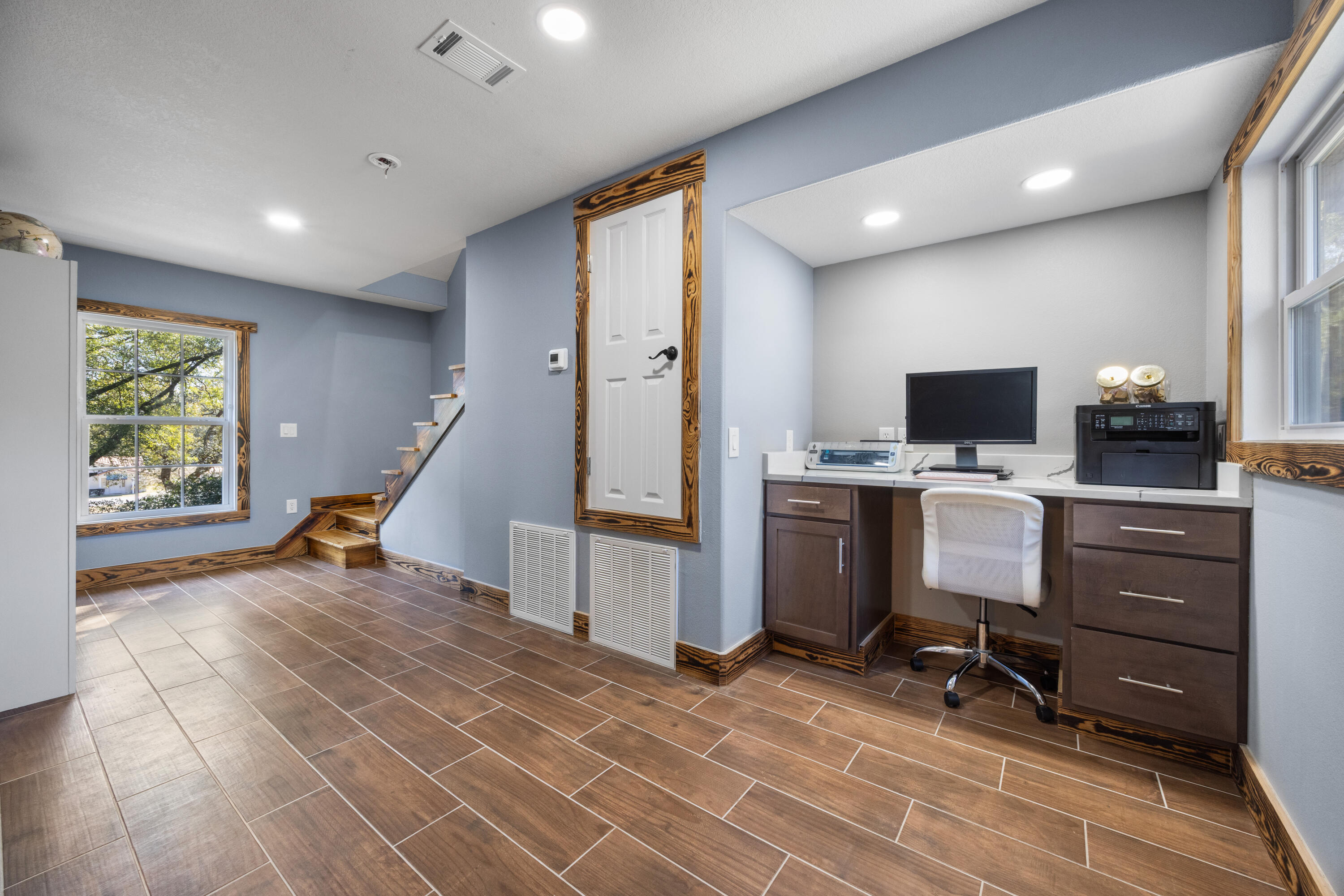 981 East Chestnut Avenue Crestview, FL 32539 - Photo 47 of 80 a view of a workspace with furniture and a window