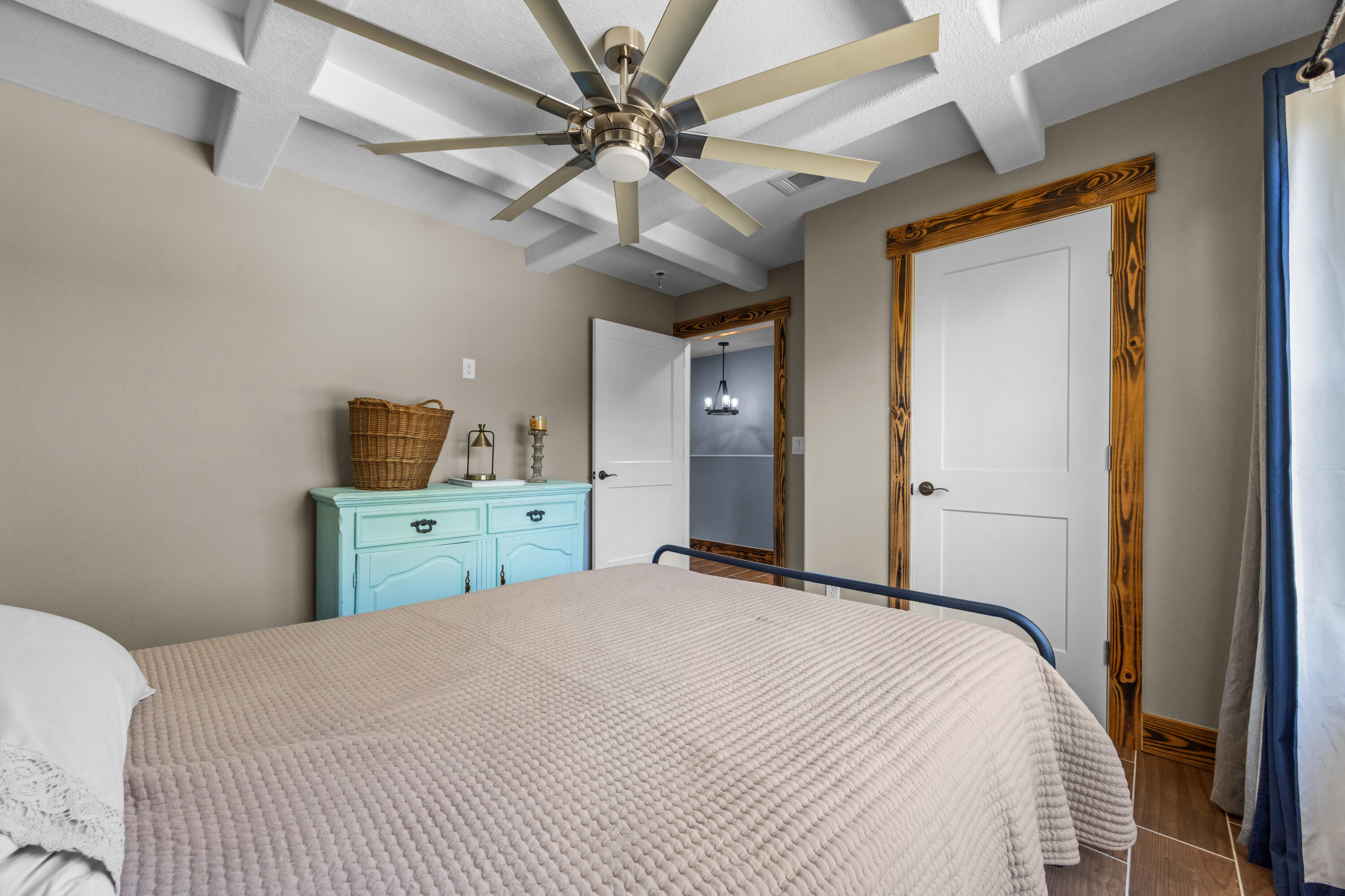 981 East Chestnut Avenue Crestview, FL 32539 - Photo 55 of 80 a bedroom with a bed and a chandelier