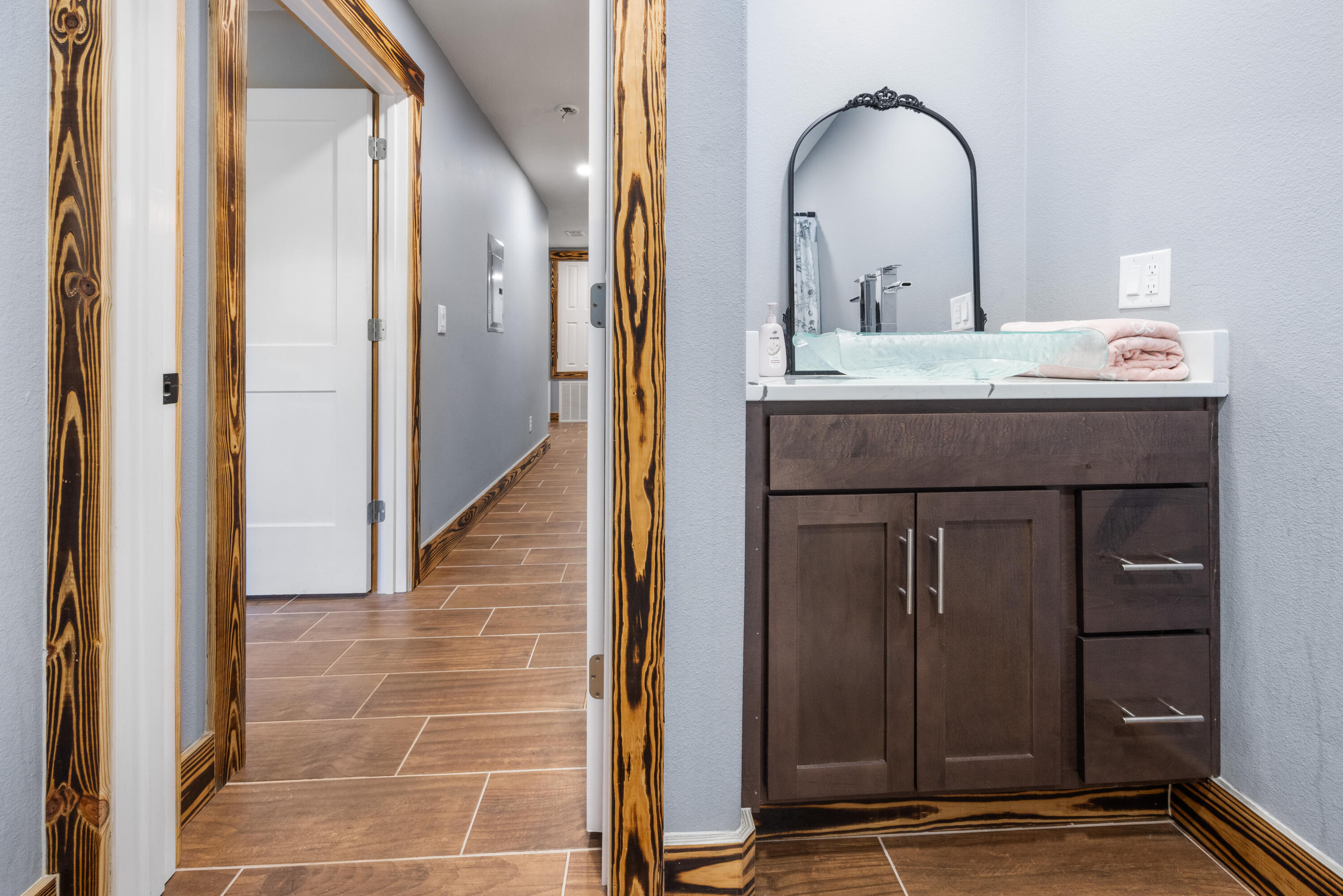 981 East Chestnut Avenue Crestview, FL 32539 - Photo 57 of 80 a bathroom with a granite countertop sink and a mirror