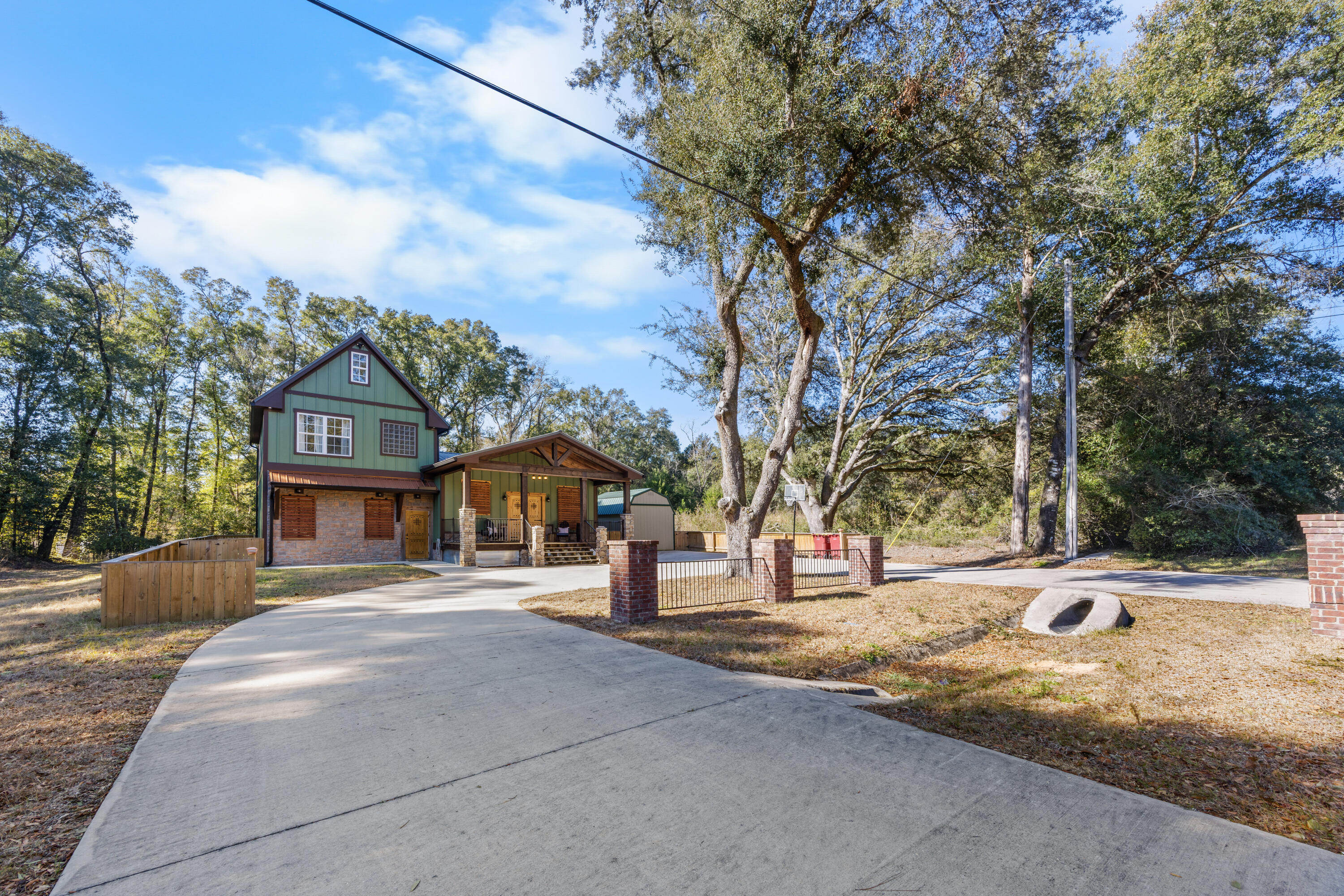 981 East Chestnut Avenue Crestview, FL 32539 - Photo 6 of 80 a front view of a house with a yard