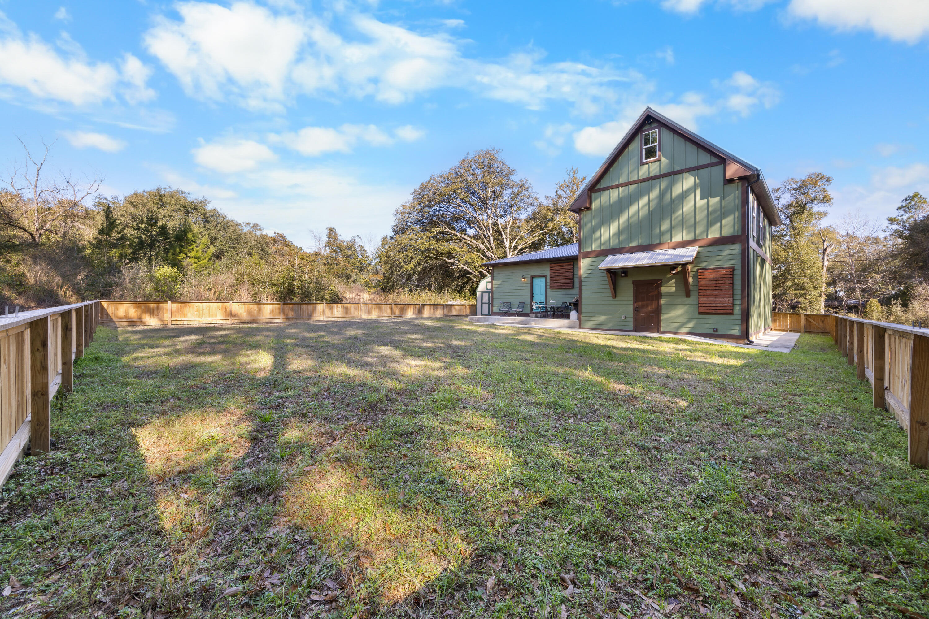 981 East Chestnut Avenue Crestview, FL 32539 - Photo 64 of 80 a front view of a house with garden