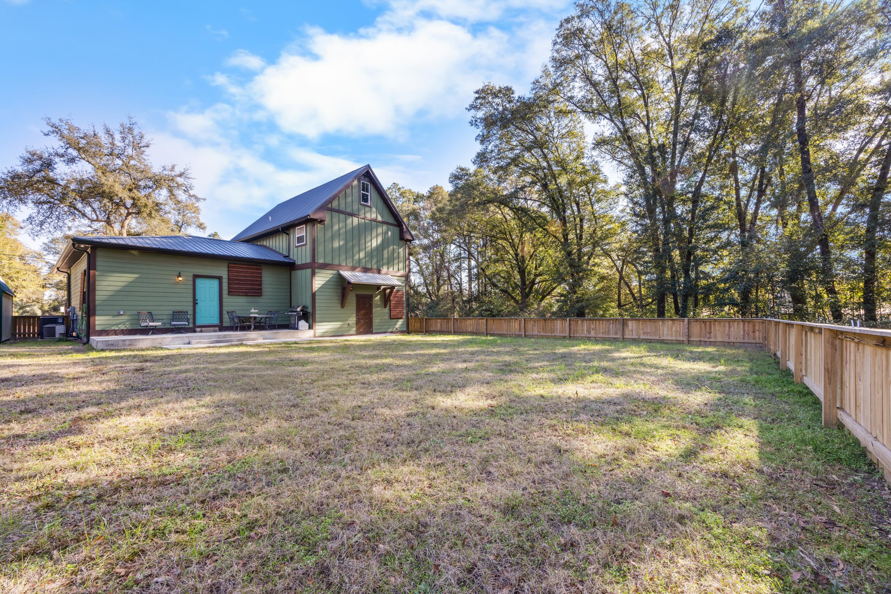 981 East Chestnut Avenue Crestview, FL 32539 - Photo 67 of 80 a view of a house with backyard and trees