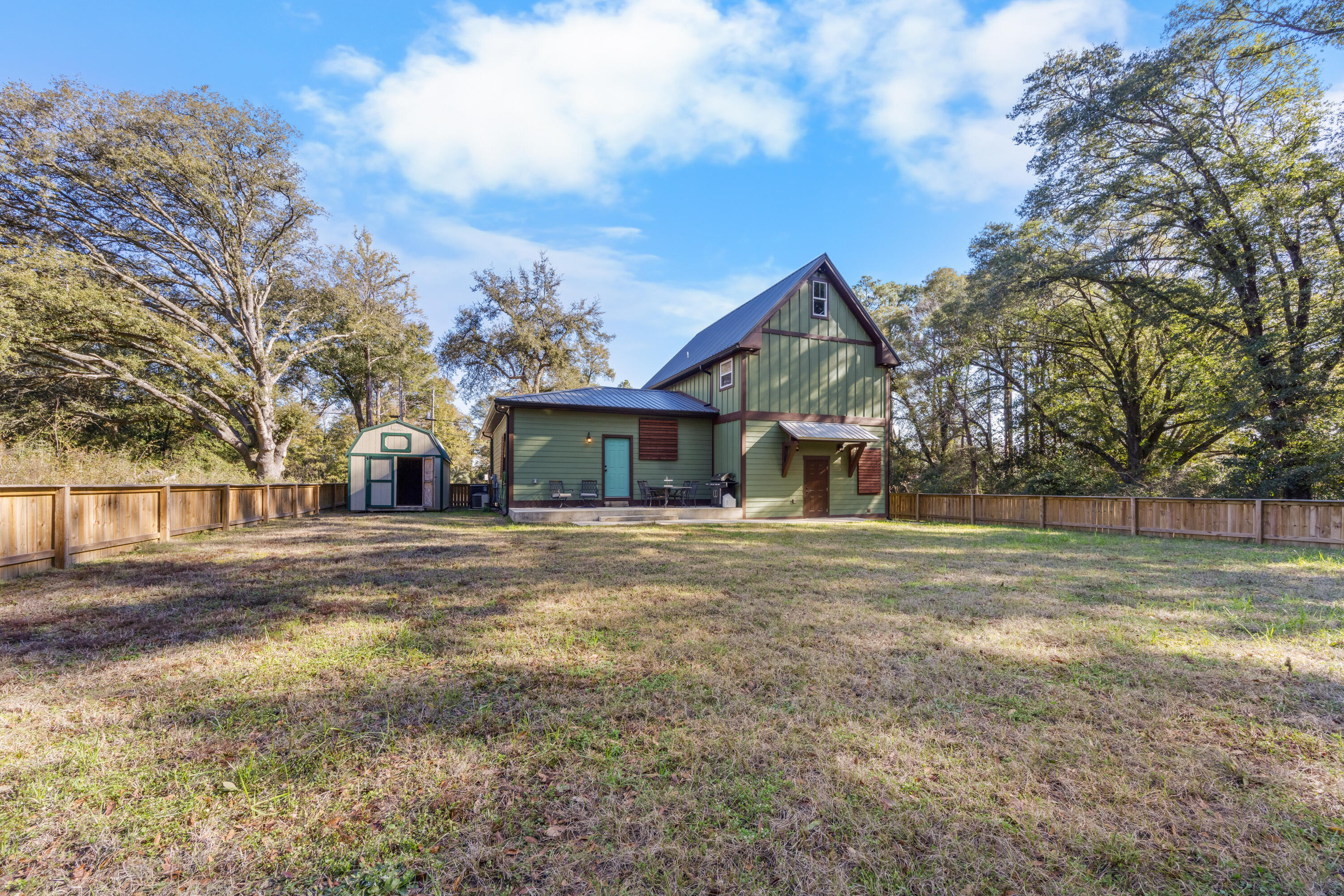 981 East Chestnut Avenue Crestview, FL 32539 - Photo 68 of 80 a front view of a house with a yard and garage