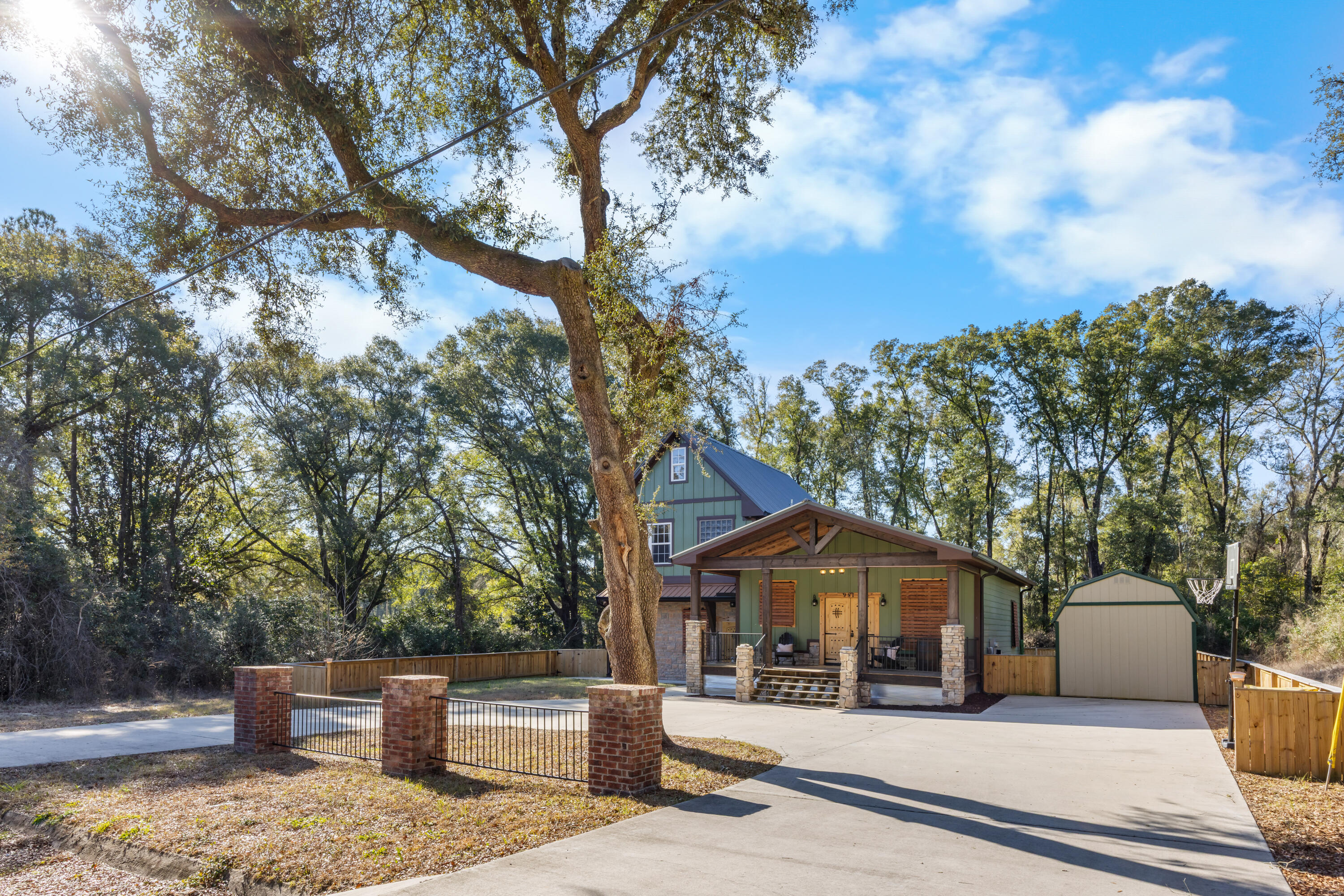 981 East Chestnut Avenue Crestview, FL 32539 - Photo 7 of 80 a front view of a house with a yard