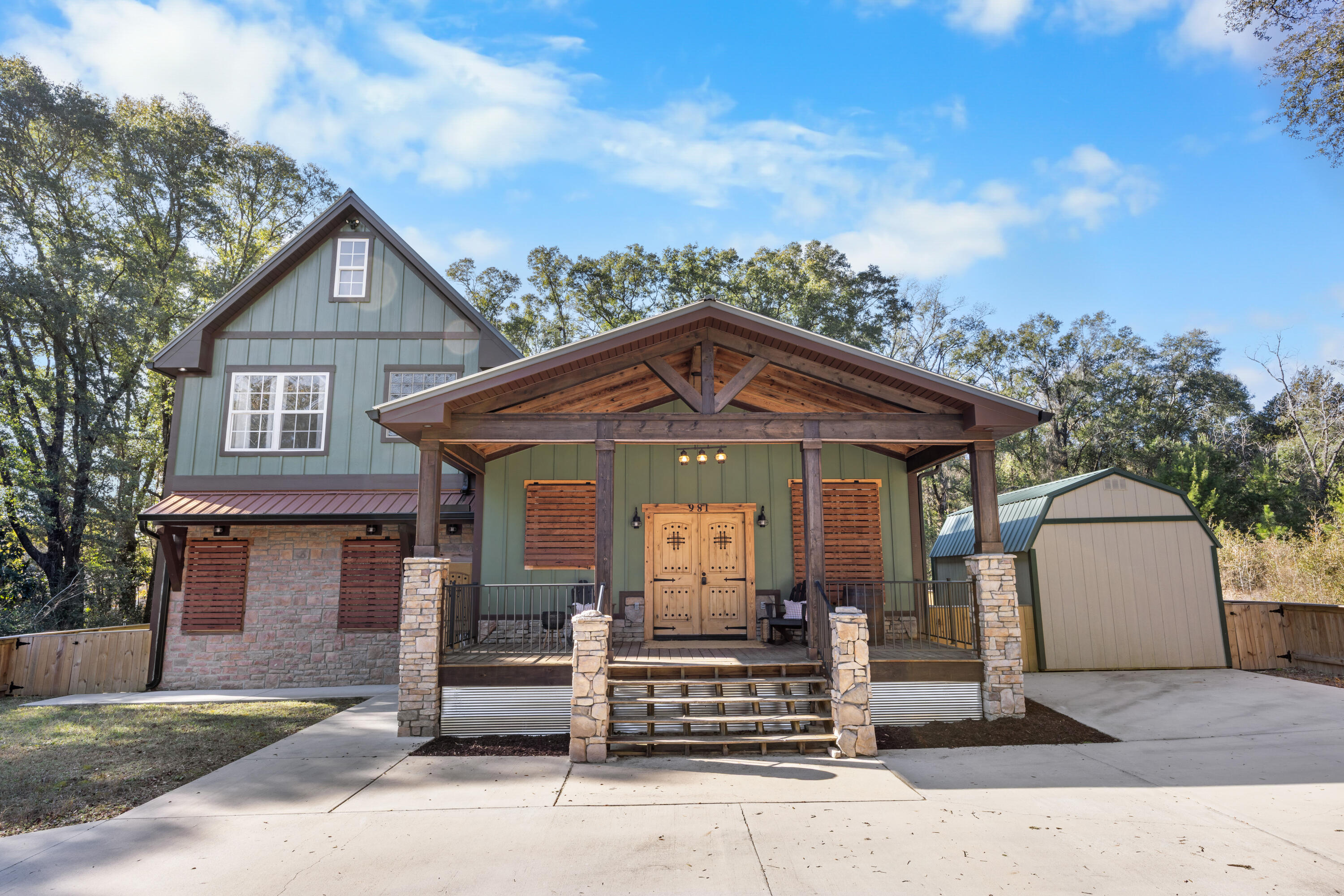 981 East Chestnut Avenue Crestview, FL 32539 - Photo 10 of 80 a front view of a house with a yard and garage