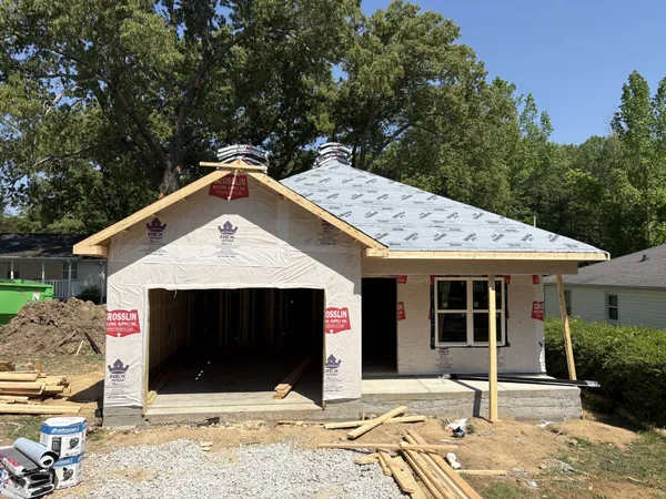 a front view of a house with a garage