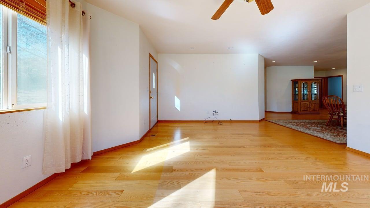 2794 9th Avenue Clarkston, WA 99403 - Photo 13 of 34 Unfurnished room with ceiling fan and light wood-style flooring